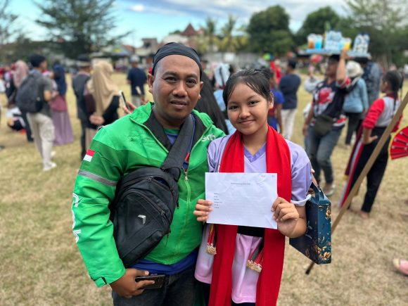 IMG-20260724-WA0003 Demi Sang Buah Hati, Driver Ojol di Banyuwangi Rela Matikan Aplikasi Saat Seleksi Gandrung Sewu 2026